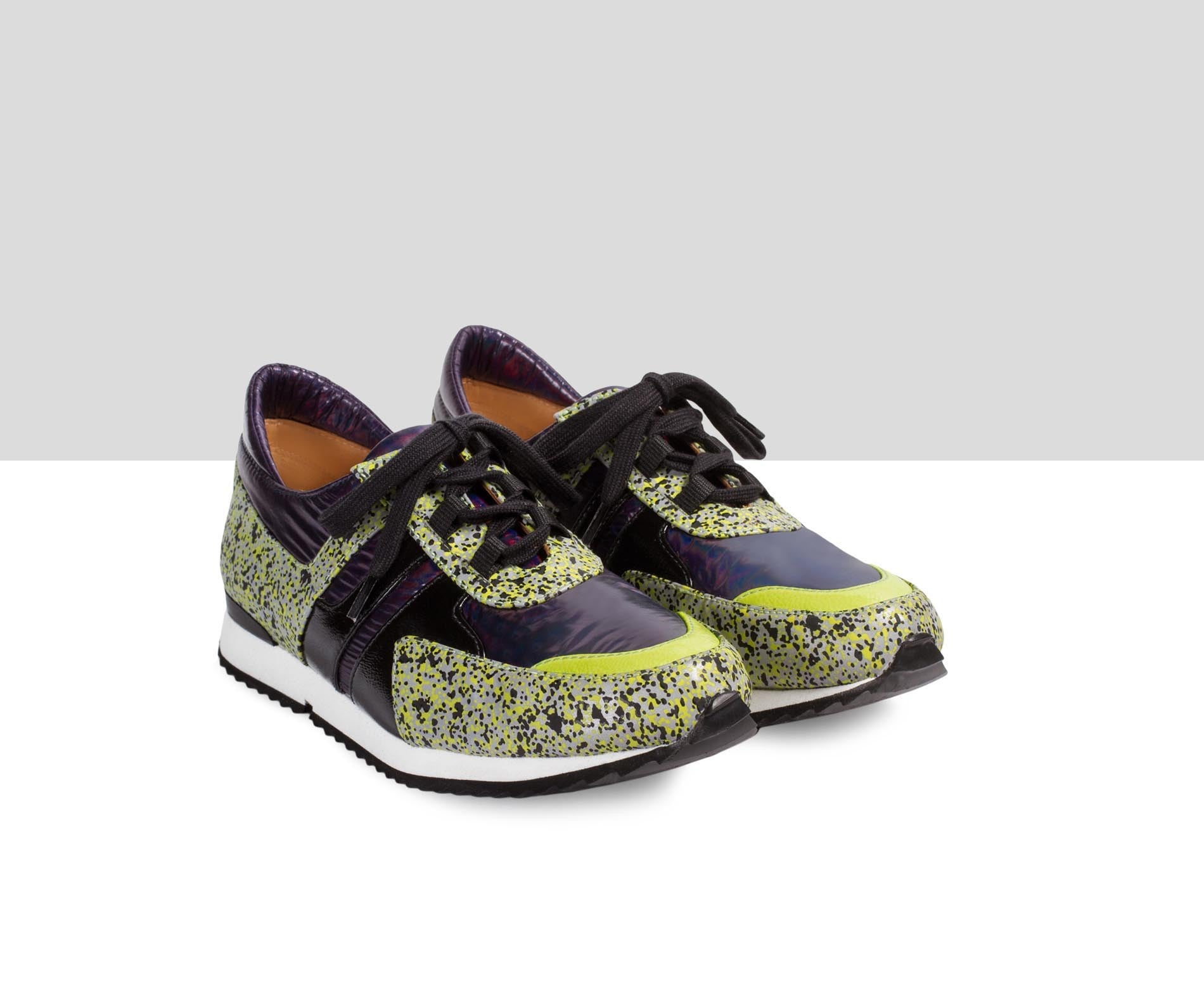 Women's leather sneaker with a low heel. Easter