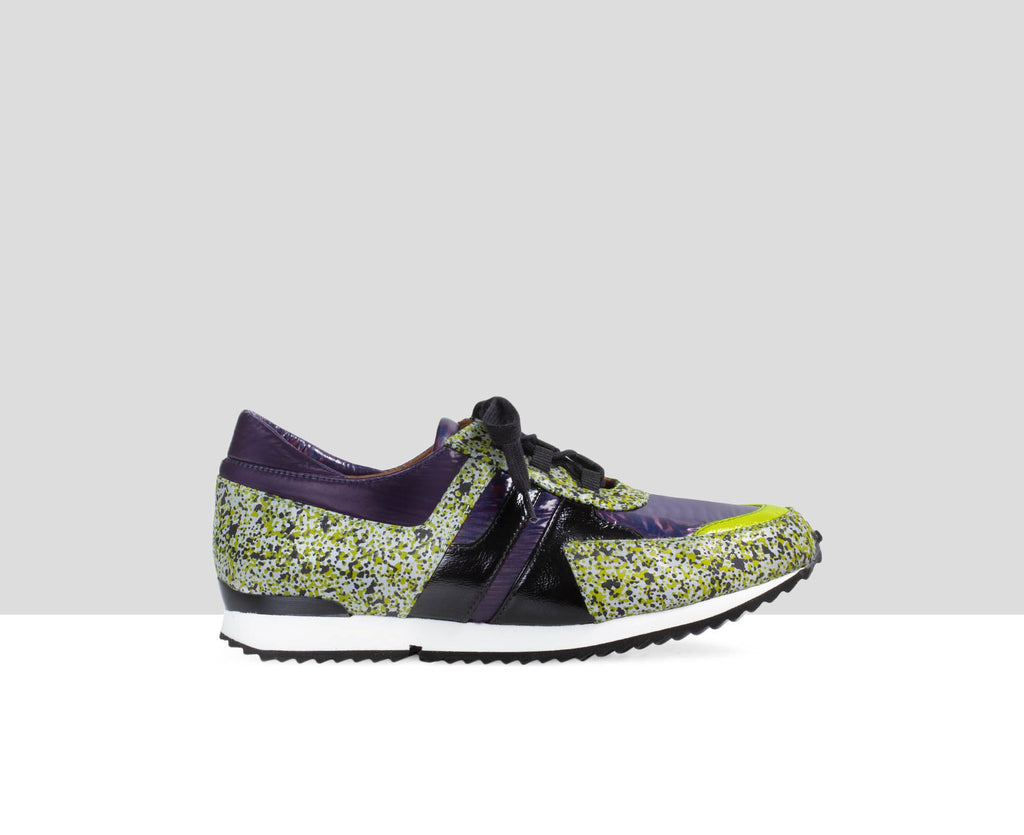 Women's leather sneaker with a low heel. Easter