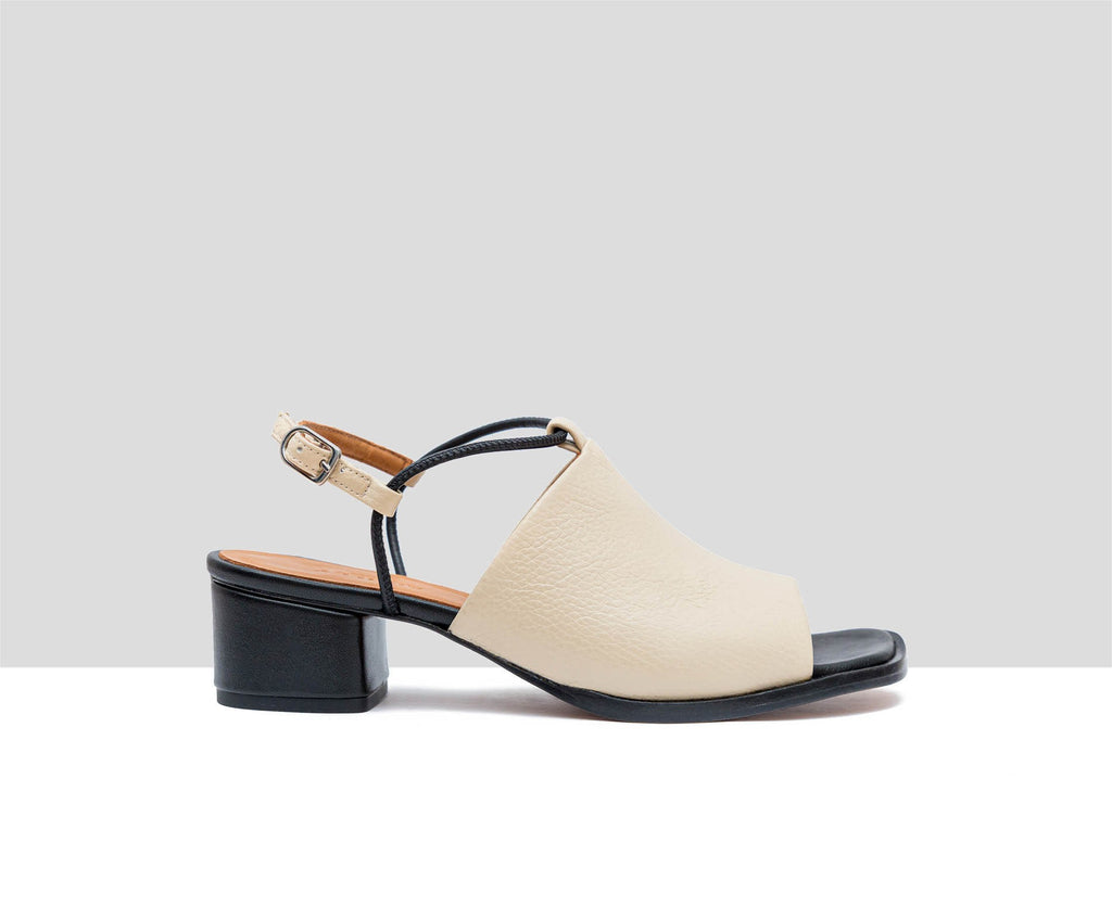 Women's leather sandal with a medium heel. Flavina