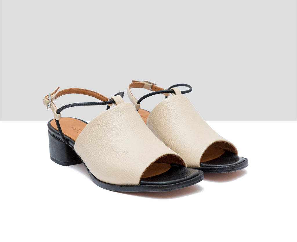 Women's leather sandal with a medium heel. Flavina