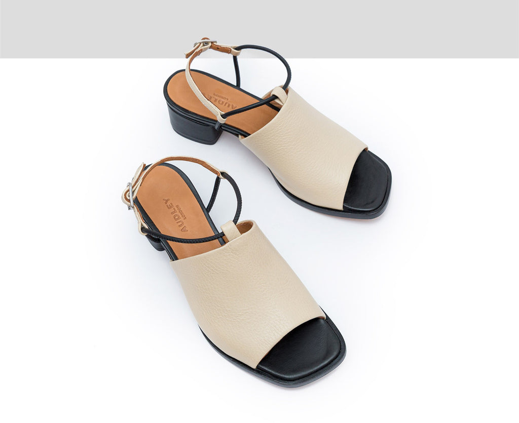Women's leather sandal with a medium heel. Flavina