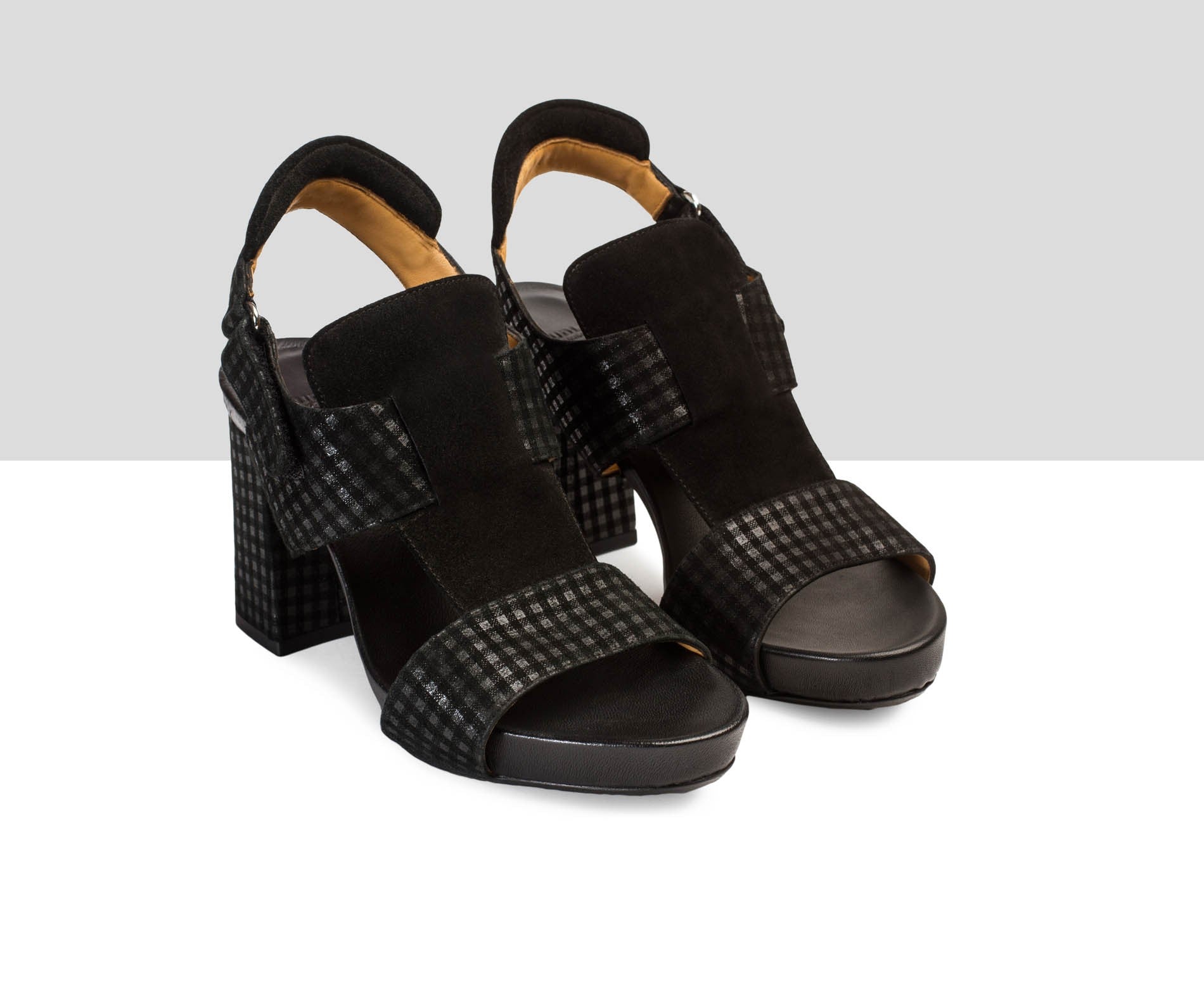 Sandalia de mujer en piel con tacón medio. Vittorina